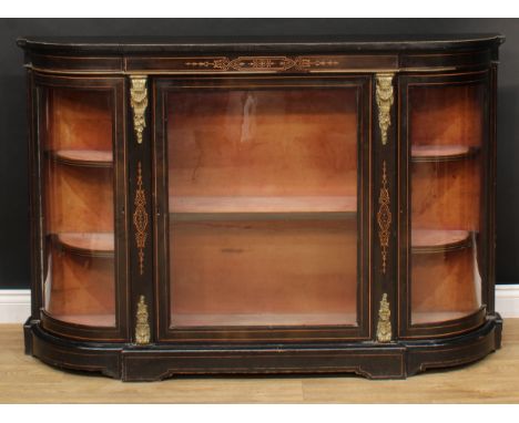 A 19th century gilt metal mounted ebonised credenza, slight break-centre top above a central glazed rectangular door enclosin