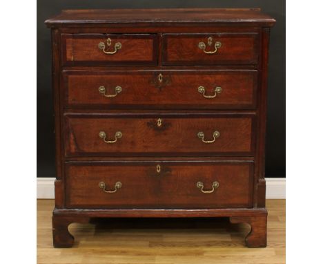 A George III mahogany crossbanded oak chest, rectangular top with moulded edge above two short and three long graduated drawe