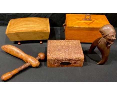 Treen - a carved Black Forest type lever-action nutcracker, carved as a man wearing a headscarf, 20cm long; an oak lidded box