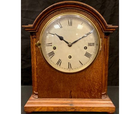 A 19th century oak bracket clock, silvered dial with Roman numerals, three winding holes, 38cm high 