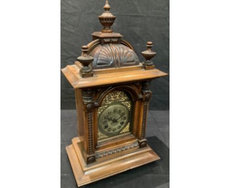 An early 20th century mahogany architectural mantel clock, Arabic numerals on brass dial, twin winding holes, 53cm high 