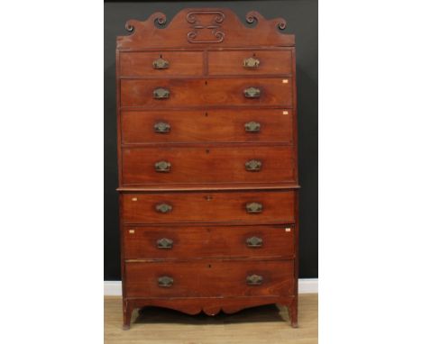 A 19th century mahogany chest on chest, possibly Channel Islands, shaped cresting above two short and three long drawers, the