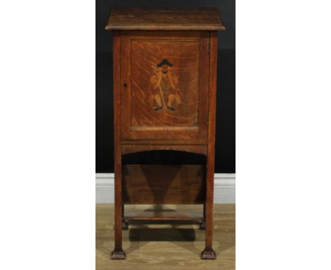 An Arts &amp; Crafts oak smoker's companion cabinet, rectangular top with moulded edge above a panel door inlaid with a seate