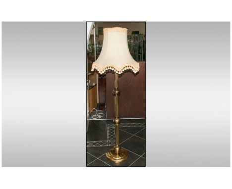 Brass Colour Standard Lamp, with a Reeded Oak Knop Stem, Terminating on a Brass Base, with Silk Shaped Shade. 68 Inches High.