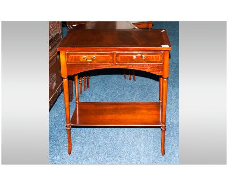 Reproduction Mahogany Sheraton Style Two Drawer Side Table with an inlaid cross banded top and round tapering legs. With a sh