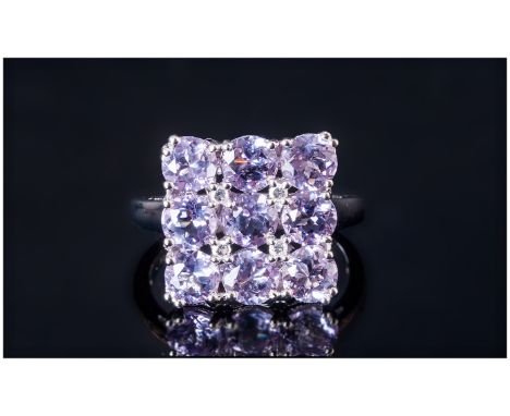 Rose de France Amethyst Chequerboard Ring, nine round cut Rose de France amethysts, a favourite of Fin de Siecle Parisian lad