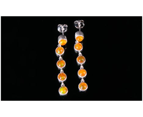 Orange Ethiopian Opal Long Drop Earrings, each earring comprising five round cut cabochons, bezel set in platinum vermeil and