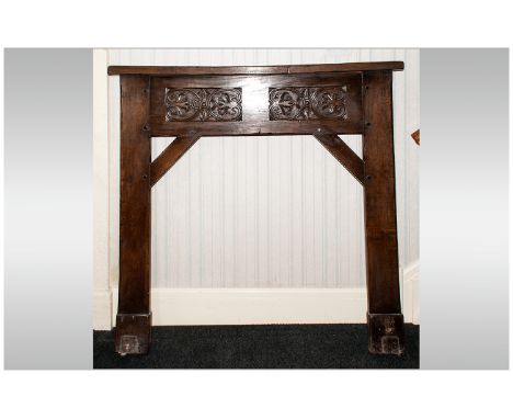 Arts and Crafts Carved Oak Cotswold School Fire Surround with floral carved decoration.