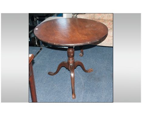 George III Oak Tilt-Top Tripod Table, of circular form, the top made from one piece of mahogany, raised on baluster turned co