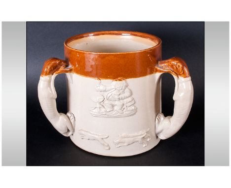 Stoneware Hunting Tyg, raised images of hounds, whippet moulded handles, c 1880.