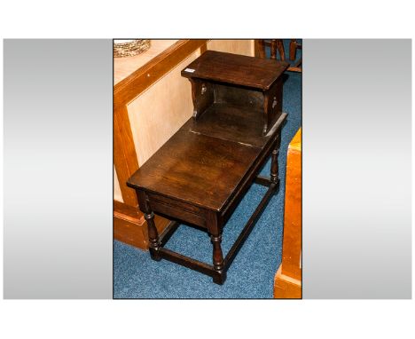 Reproduction Oak Hall Table in the Jacobean Style. With a lift up lid compartment and with a raised shelf.