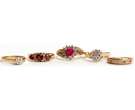 Mixed Lot: three modern 9ct gold diamond set rings, 9ct red stone and diamond ring, together with a 9ct gold and paste ring, 