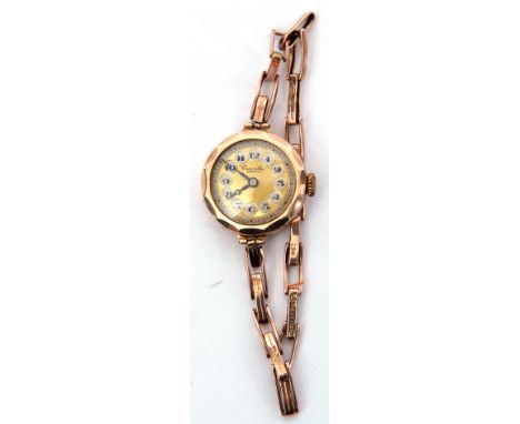 Ladies vintage hallmarked 9ct gold cased wrist watch by Everite, having blued steel hands to an engine turned gilded dial wit