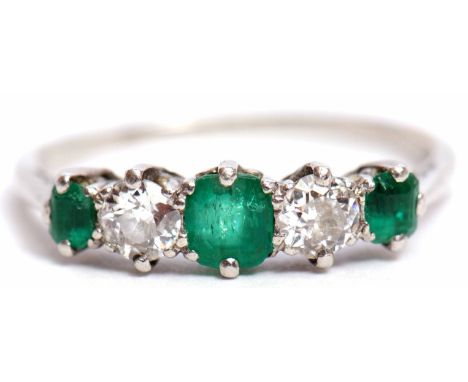 Precious metal emerald and diamond five-stone ring, alternate set with 3 graduated emeralds and 2 diamonds, 0.20ct each appro