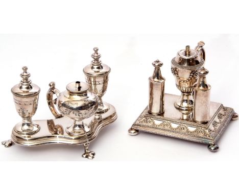 Early 20th century silver plated triple table lighter, the base of lobed design with three vase shaped lighters, scrolled han