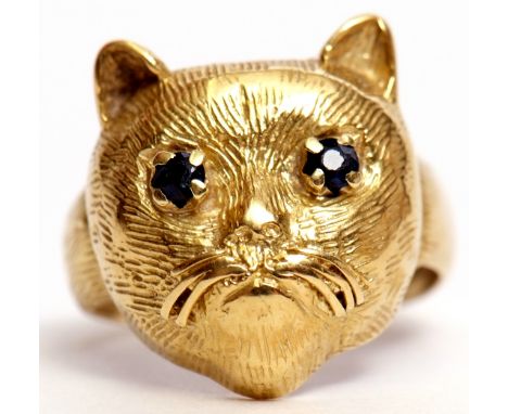 Antique yellow gold cat ring, the naturalistic cat's textured profile set with two small circular cut sapphire eyes, 5.2gms g