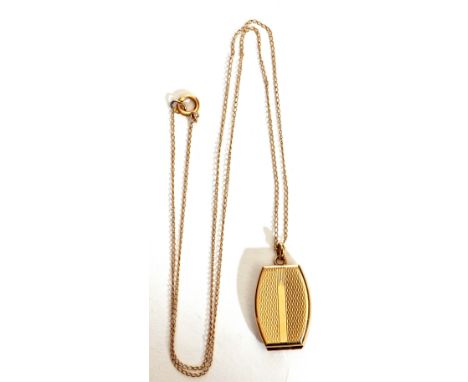 9ct barrel shaped locket, engine turned engraved front, plain polished verso, 2 x 1.5cm, suspended from a yellow metal fine t