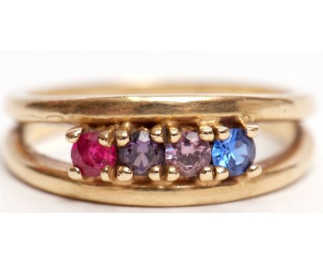 Yellow metal dress ring, the split polished shank set with 4 small precious gemstones, size P (unmarked)  