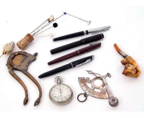 Tray including Victorian Meerschaum pipe, a hand holding a cracked egg and chick (cased) (a/f), a silver band (a/f), four fou