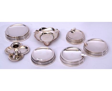 Mixed Lot: set of five Elizabeth II silver encased ash trays of circular form with reeded sides and loaded bases in Art Deco 