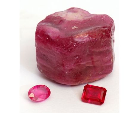 Loose oval faceted ruby, 8 x 6mm, 0.4gms, an un-set hydrothermal rectangular shaped ruby, 8 x 6mm, 0.6gms together with a pin