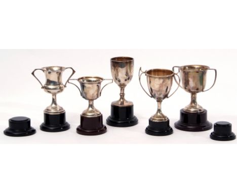 Mixed Lot: comprising five hallmarked silver trophy cups, all with twin handles, together with seven plastic stands, the silv