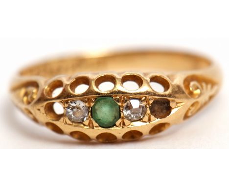 Edwardian 18ct gold emerald and diamond ring, boat shaped, centring a circular cut emerald flanked by 2 small diamonds (with 