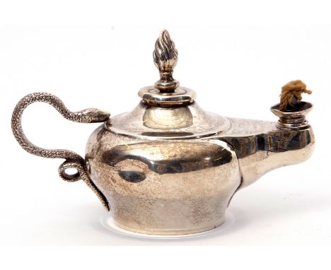 Edwardian table lighter in the form of an Aladdin oil lamp, having naturalistically engraved serpent handles, flambeau finial