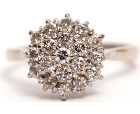Diamond cluster ring, the three tiers of brilliant cut diamonds all in a basket mount, stamped 18ct, diamond carat weight 1.2
