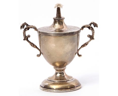 George V table lighter of trophy vase form to a circular foot with reeded rim and cast caryatid handles, Birmingham 1912, by 