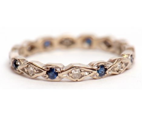 Diamond and sapphire full eternity ring alternate set in a Celtic design with small diamonds and sapphires, hallmarked Birmin