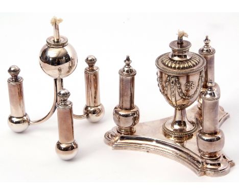 Edwardian multi-light silver plated table lighter, the base of shaped triangular form, three baluster side lighters and centr