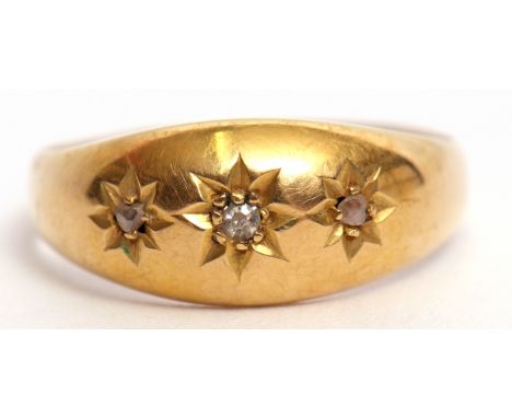 Edwardian 18ct gold and diamond three stone ring featuring three small single cut diamonds, each in star engraved setting, Bi