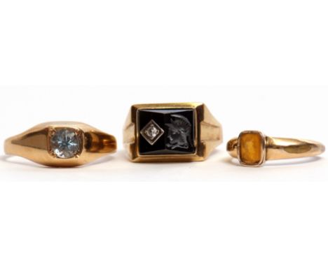 Mixed Lot: gent's dress ring set with a carved haematite panel and highlighted with a white stone, 9ct blue stone ring, toget