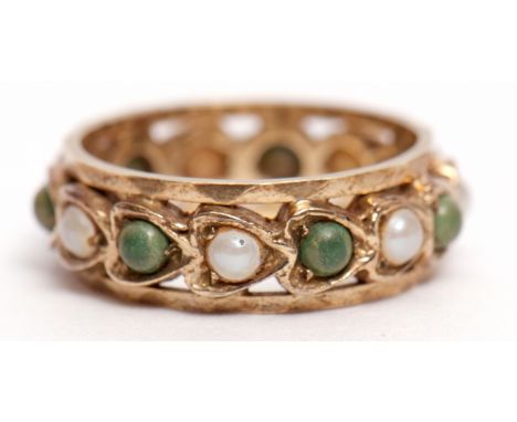 9ct gold eternity ring alternate set with seed pearls and green stones in a Celtic style, size J