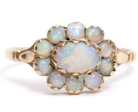 9ct gold and opal cluster ring, an oval design with central large opal within a surround of 10 small circular cabochon opals,