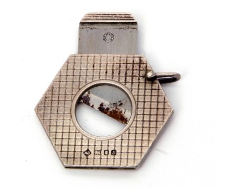 Elizabeth II silver encased and steel bladed cigar cutter of hexagonal form with engine turned grid engraving, London, 1973, 