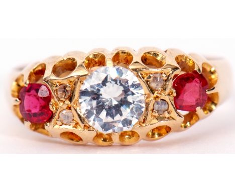 Late 19th century 18ct gold, ruby and paste set ring, the centre white stone between two small cushion cut rubies and highlig