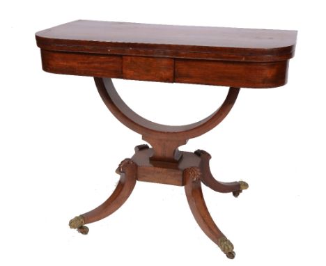 A REGENCY MAHOGANY FOLD OVER CARD TABLE with inlaid decoration on hoop support and four splay legs terminating in brass feet 