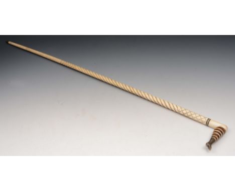 A 19TH CENTURY BONE OR NARWHAL WALKING STICK with spiral column, the handle in the form of a ladies leg with banded decoratio