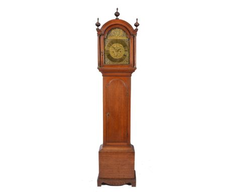 AN OAK EIGHT DAY LONGCASE CLOCK the arched brass dial with Roman chapter ring, Arabic five minutes and acanthus scroll engrav
