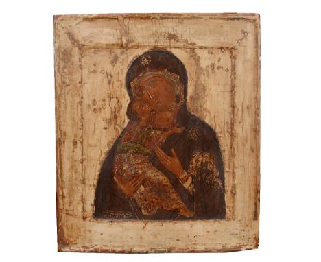 AN ORTHODOX ICON depicting The Virgin of Vladimir on a plain buff ground and on a pine panel, 26cm x 31cm