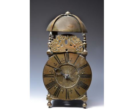 A LATE 17TH/EARLY 18TH CENTURY LANTERN CLOCK, the Roman chapter ring with stylised sword hilt half hour marks, signed I Gibso