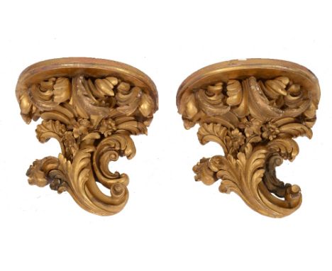 A PAIR OF 19TH CENTURY GILTWOOD BOW FRONTED WALL SCONCES with rococo acanthus scroll supports, approximately 34cm wide and hi