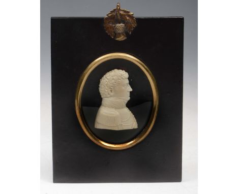 AN IVORY SILHOUETTE MINIATURE PORTRAIT of an Officer in naval uniform in ebonised frame with acorn hanger, 15cm x 10cm overal