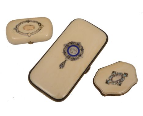 A GROUP OF THREE VICTORIAN IVORY SILVER AND ENAMEL INLAID RETICULES, each with central plaque, 14cm max.