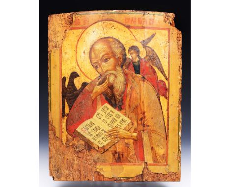 AN EARLY ORTHODOX ICON depicting St John The Evangelist holding the Bible open on John Chapter 1, Verse 1, with attendant eag