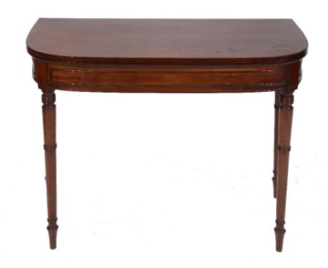 A GEORGE IV ROSEWOOD FOLD OVER CARD TABLE, 'D' shaped, with baize playing surface and on ring turned tapering legs, 92cm wide