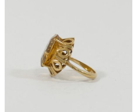 A yellow metal citrine set single stone ring, the head of the ring 2cm x 1.6cm, the shank stamped '0.585' within rhombus cart