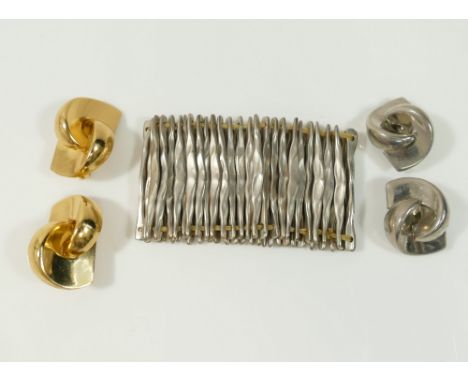 A pair of gold plated Christian Dior clip-on earrings, 3.8cm long, a pair of similar silver plated clip-on earrings and a sil